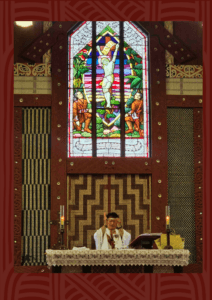 The Easter Sunday service at Meri Kuia (St Mary's Church, Tikitiki), beneath the church's iconic stained glass window depicting the crucifixion.